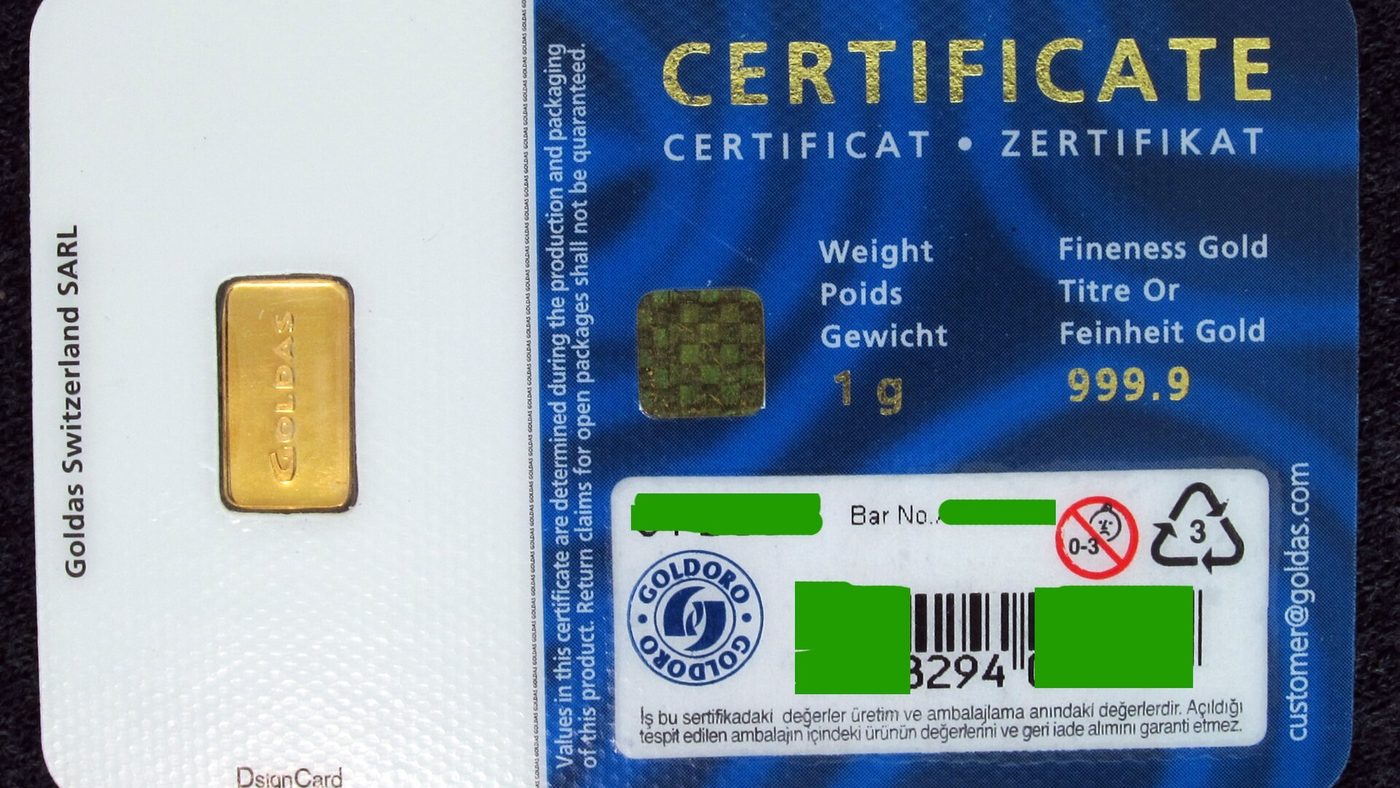 A one gram gold bullion bar sealed in an assay card marked 999.9 fineness